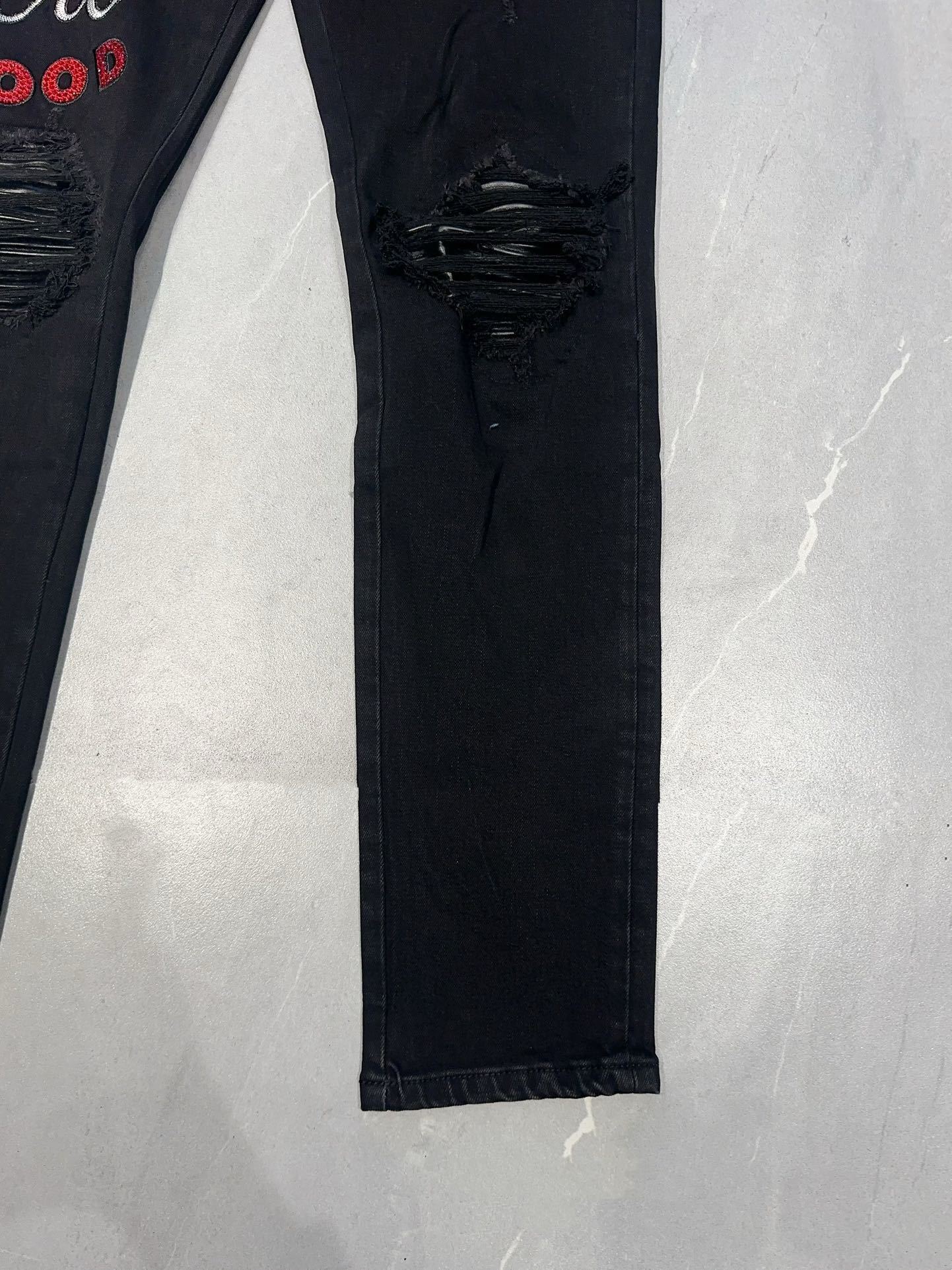 AMIRI EMBROIDERED DISTRESSED JEANS