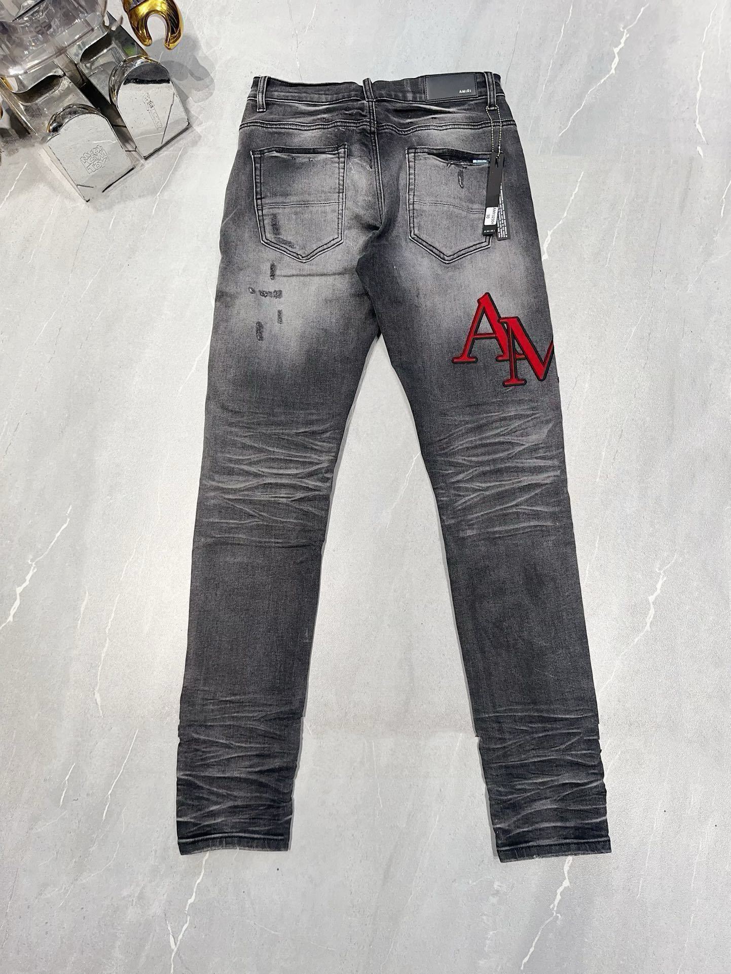 AMIRI DISTRESSED SKINNY JEANS