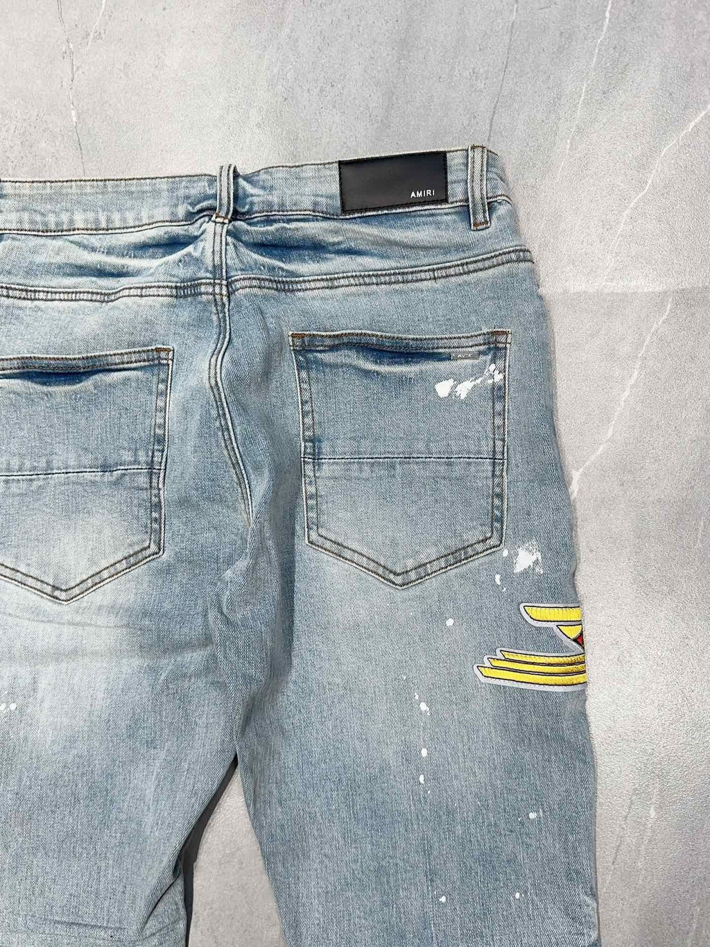 AMIRI DISTRESSED CEMENT CALIFORNIA SKINNY JEANS