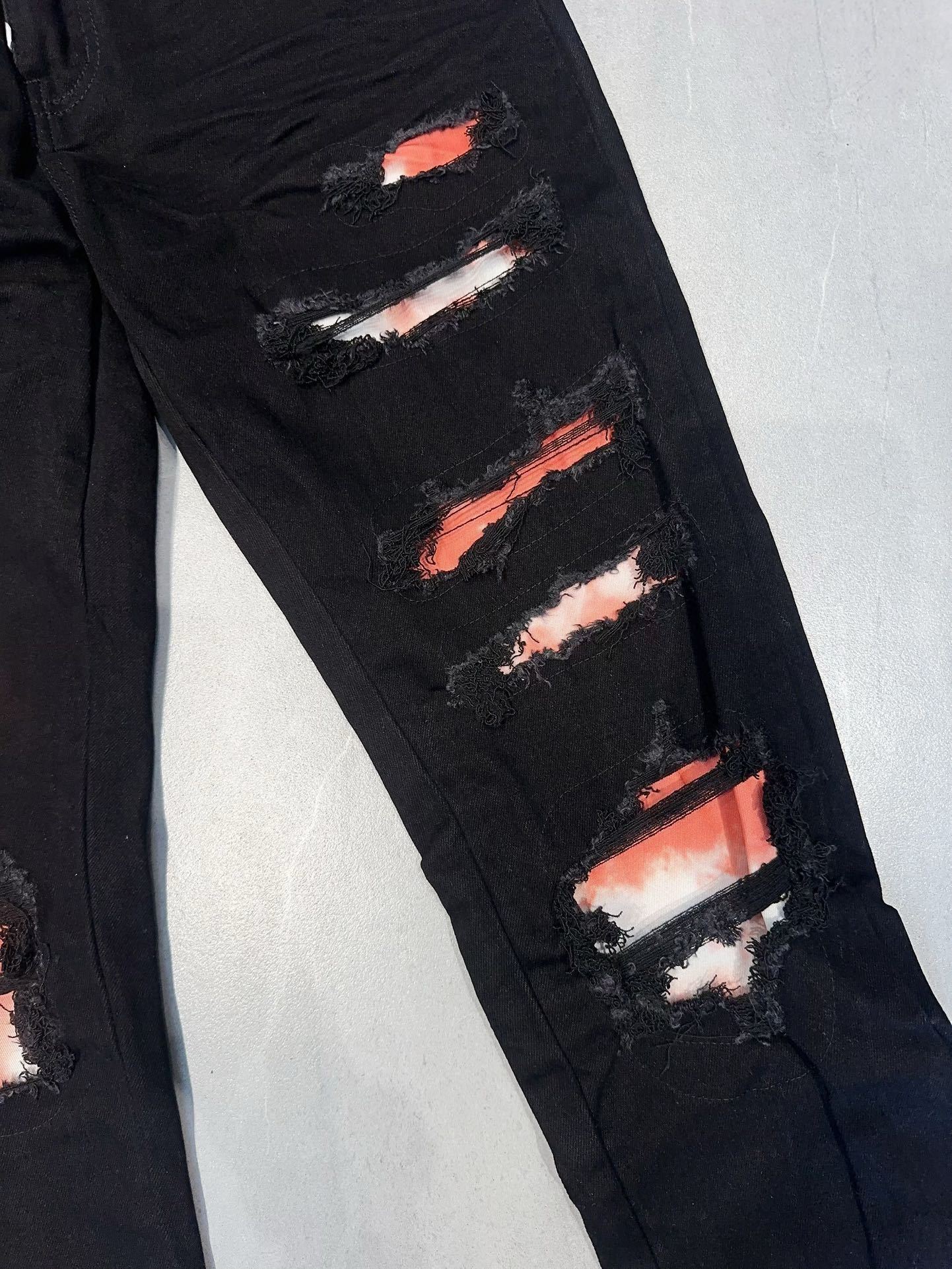 AMIRI WAXED LOGO-APPLIQUE SKINNY JEANS