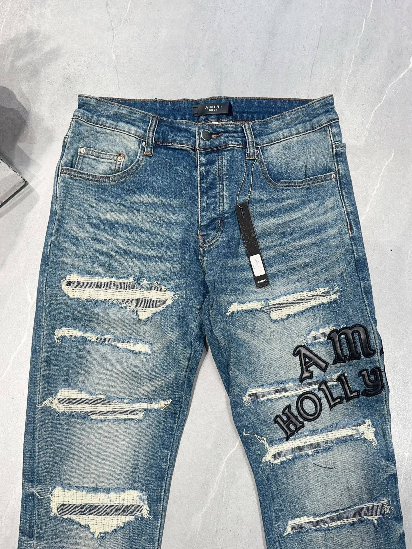 AMIRI DISTRESSED EMBROIDERED JEANS
