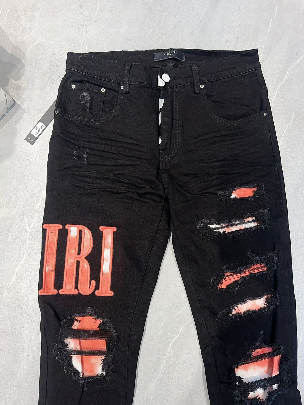 AMIRI WAXED LOGO-APPLIQUE SKINNY JEANS