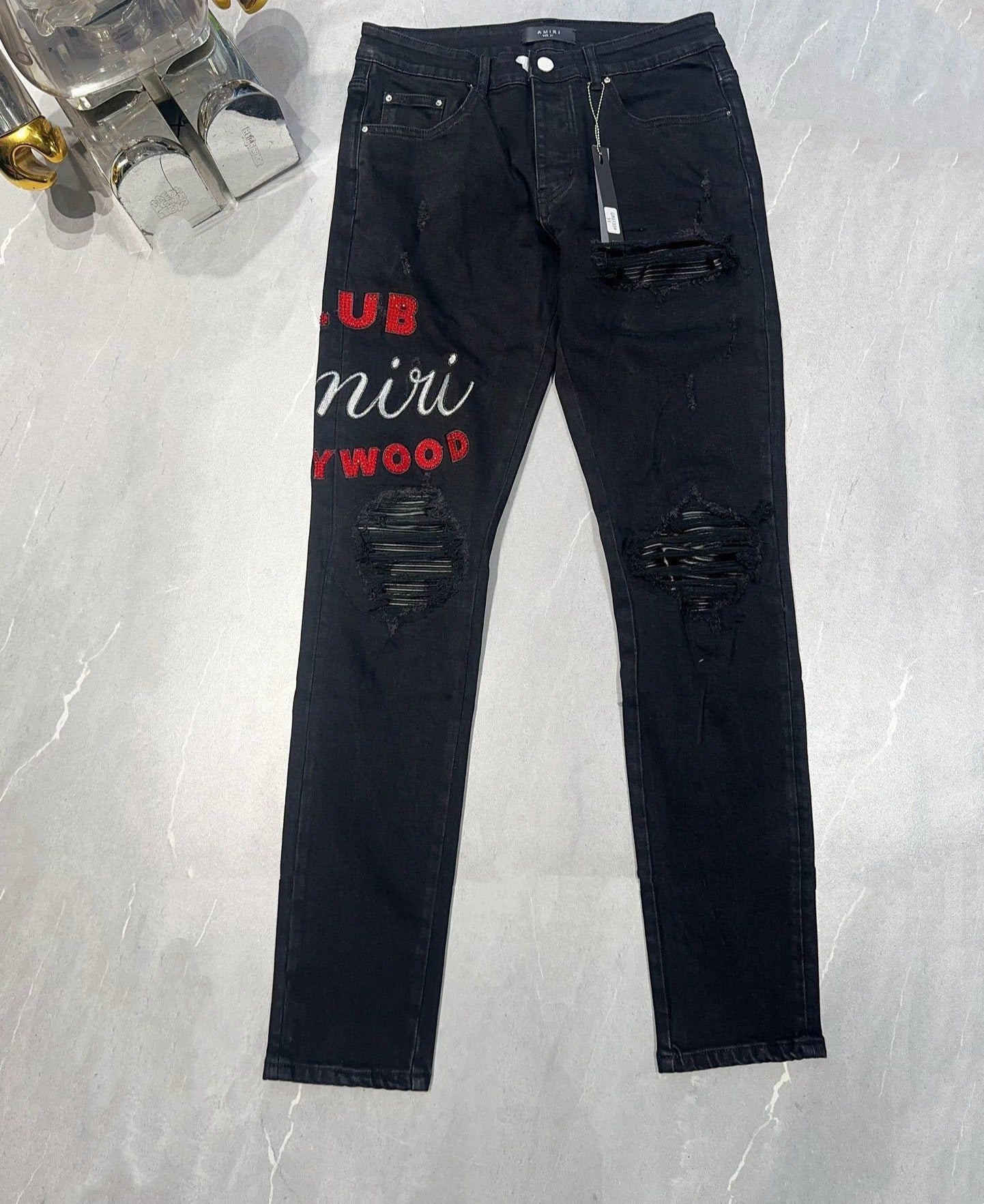 AMIRI EMBROIDERED DISTRESSED JEANS