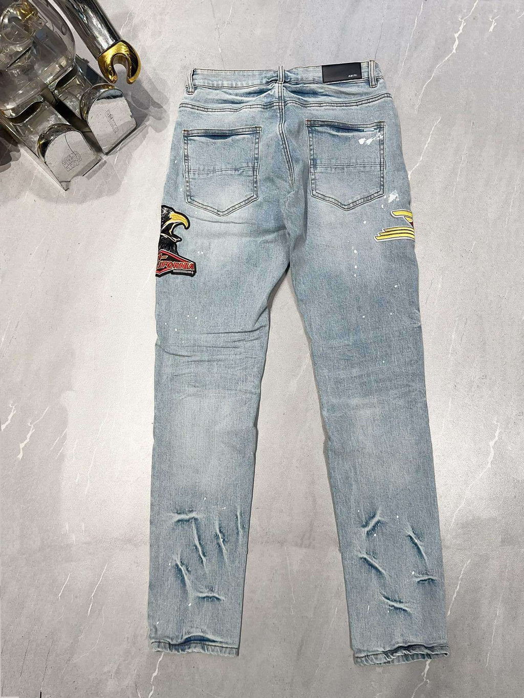 AMIRI DISTRESSED CEMENT CALIFORNIA SKINNY JEANS