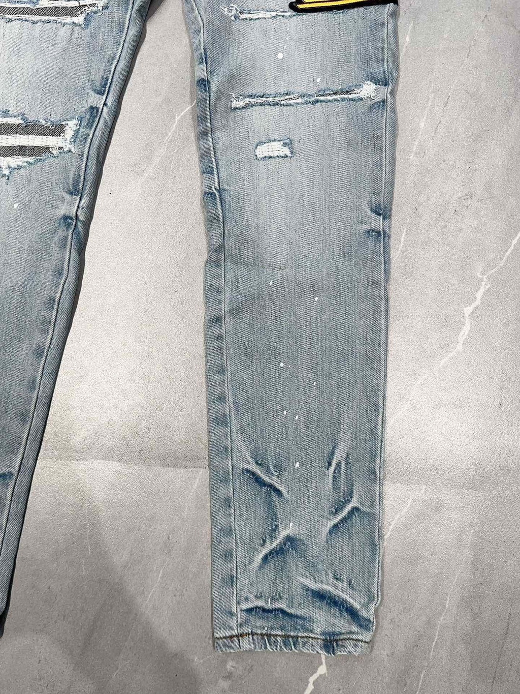 AMIRI DISTRESSED CEMENT CALIFORNIA SKINNY JEANS
