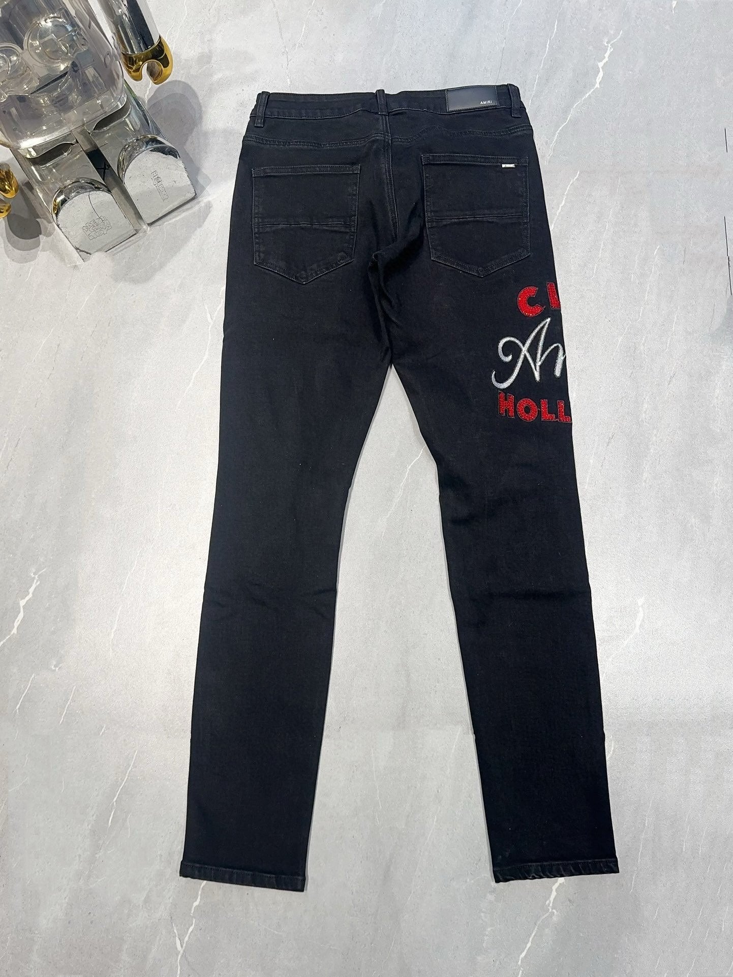 AMIRI EMBROIDERED DISTRESSED JEANS
