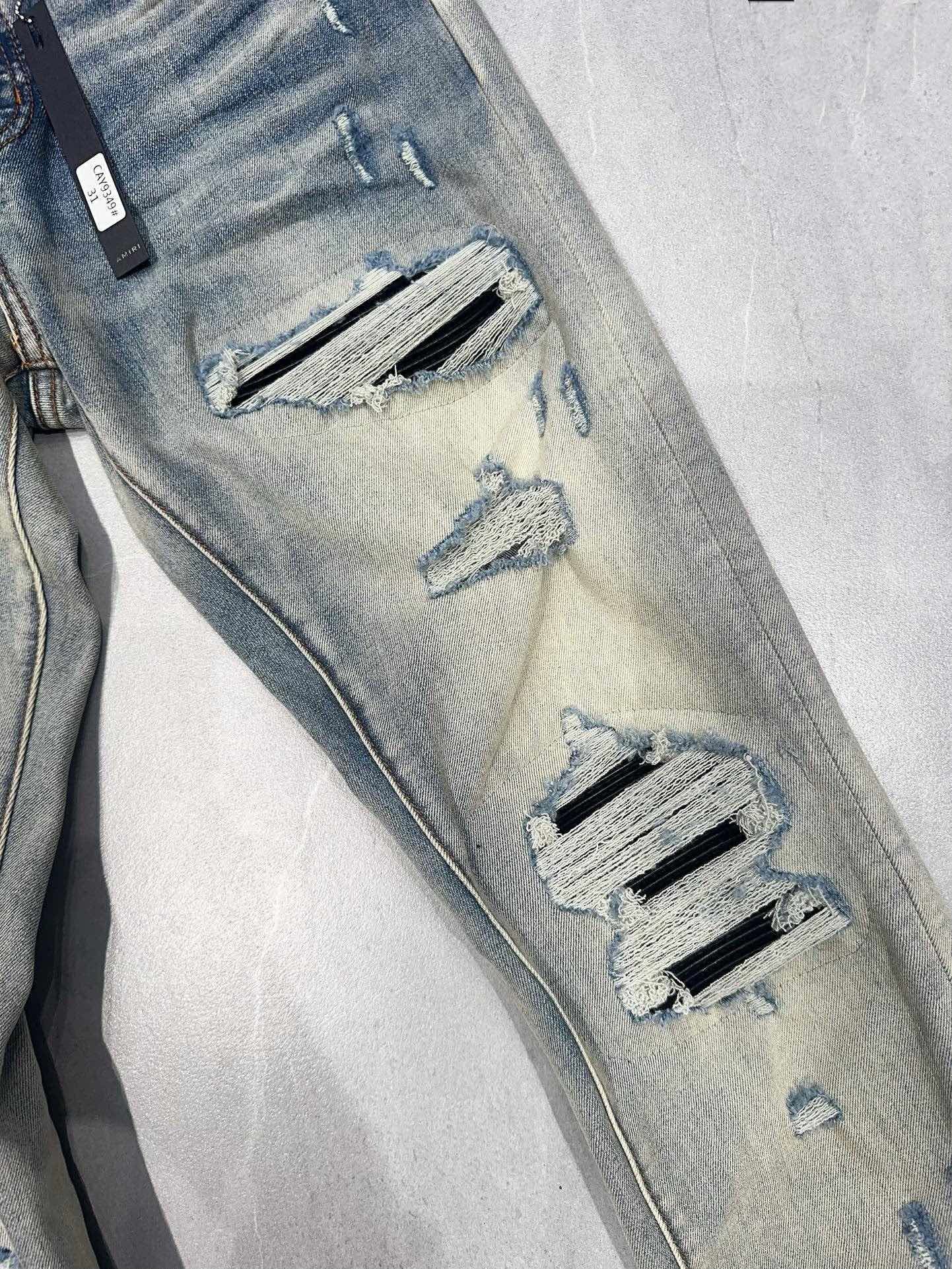 AMIRI MX1 RIPPED SKINNY JEANS