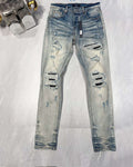 AMIRI MX1 RIPPED SKINNY JEANS