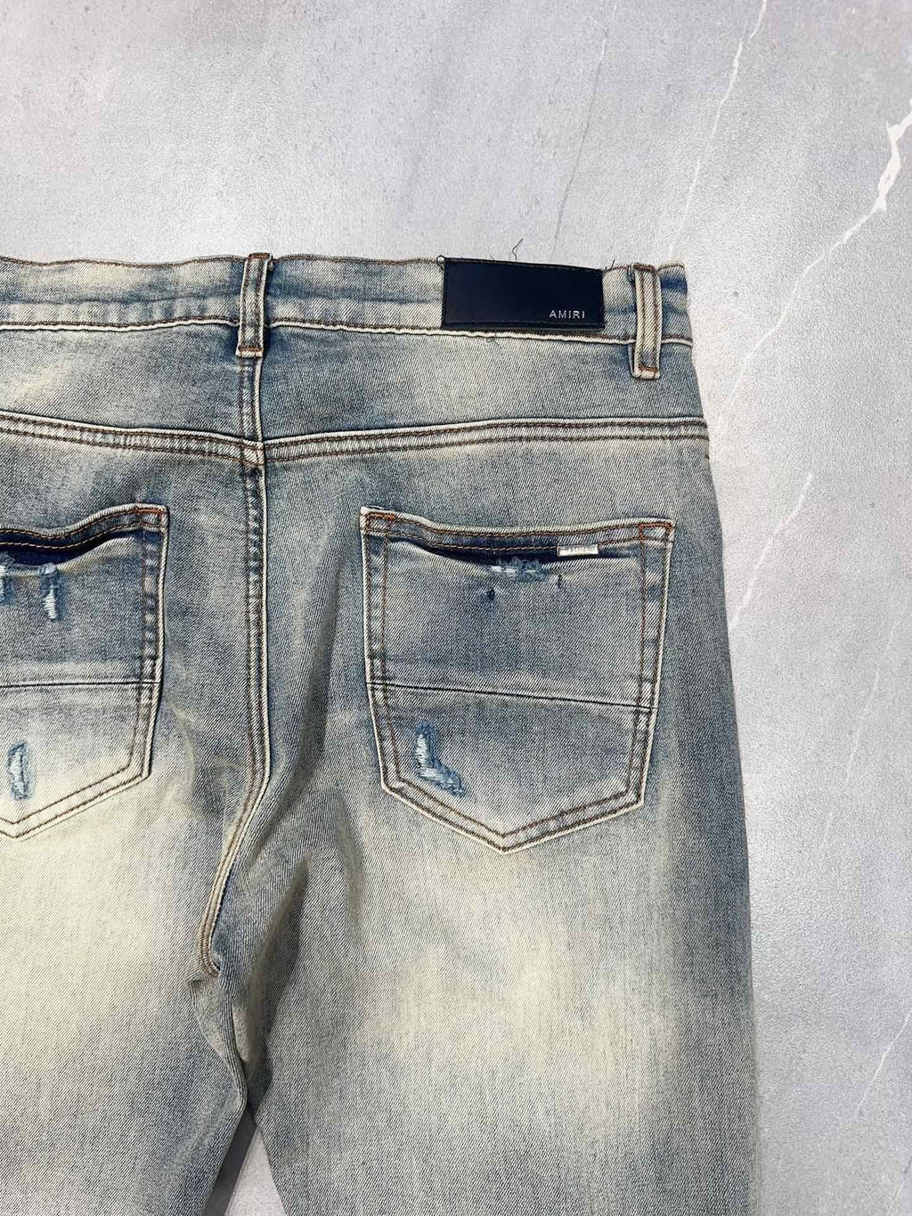 AMIRI MX1 RIPPED SKINNY JEANS