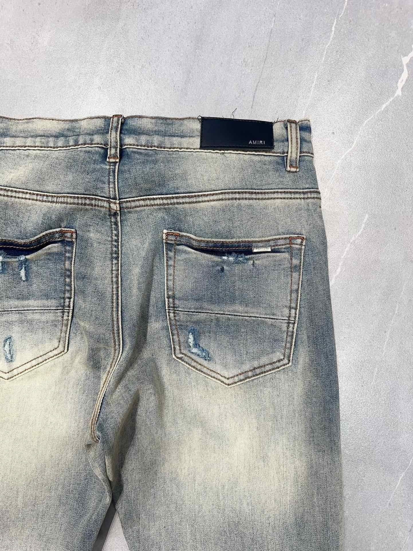 AMIRI MX1 RIPPED SKINNY JEANS