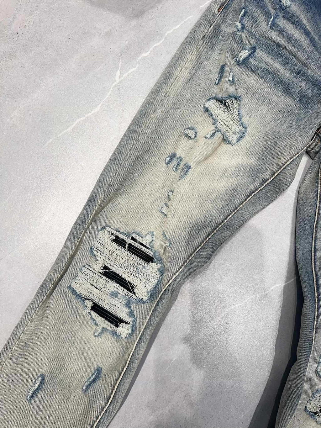 AMIRI MX1 RIPPED SKINNY JEANS